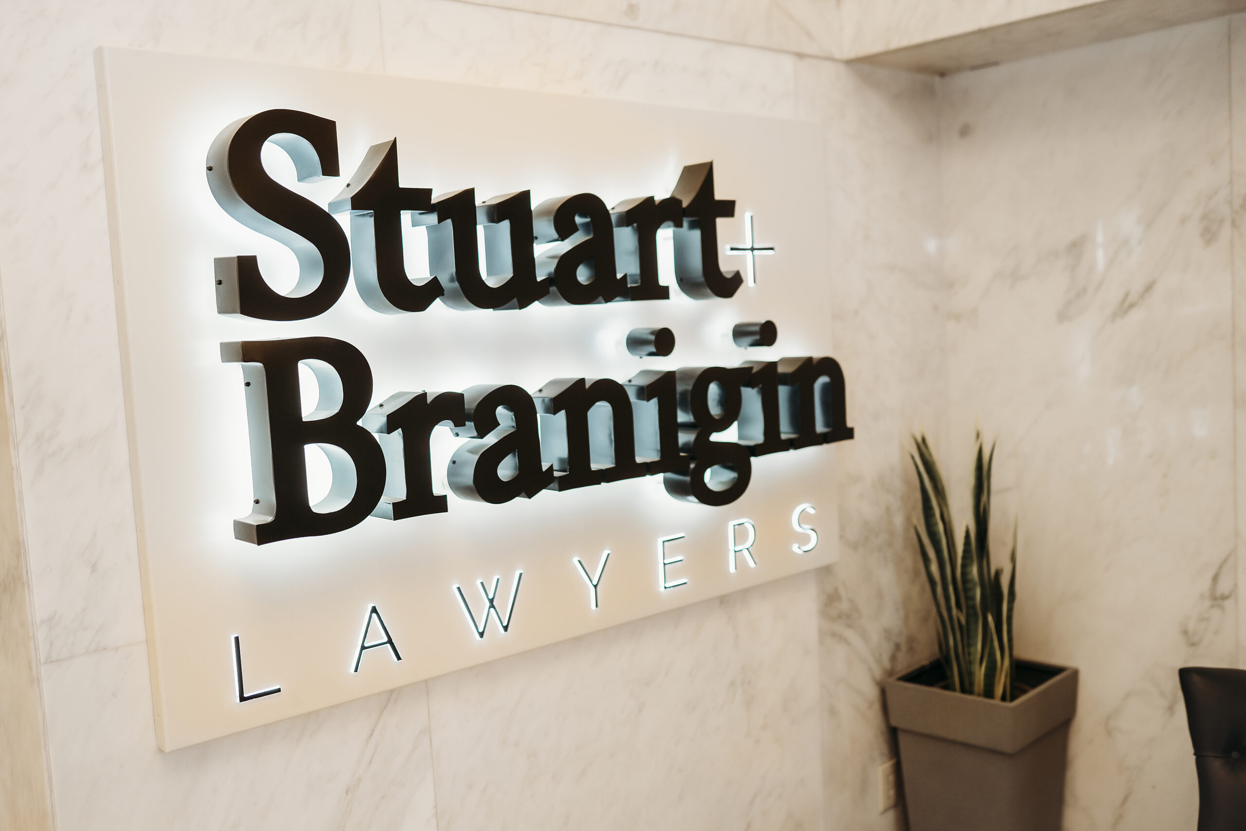 Backlit Stuart & Branigin business sign